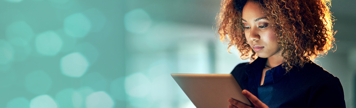 Woman using a digital tablet for remote work and online communication